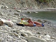 On the Bulgarian beach, tourist finds naked chick and convinces her to give him a quick blowjob 7