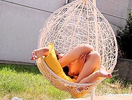 Attractive teen brunette strips naked and enjoys playing with her pink pussy on a sunny day in the yard 6