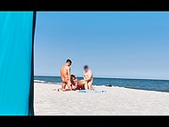 Voyeur spies on eccentric couple who doesn't mind having threesome with stranger on the beach