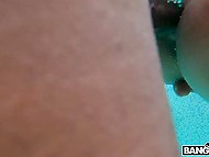 Oriental chick takes off green swimsuit and gets fucked by young black guy in the pool 6