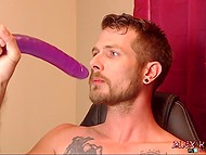 Guy with tattoos above beautiful nipples bangs his own throat with the long dildo in a solo show 9