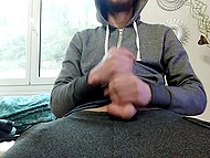 Bearded guy in hoodie shows how hands help him satisfy hard cock when he is alone 4