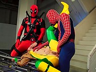 Provocative slender young woman shows off body to Spider-Man and Deadpool who penetrate her together 10