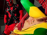 Provocative slender young woman shows off body to Spider-Man and Deadpool who penetrate her together 9
