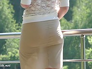 Eccentric redhead in sexy skirt flashes pussy while walking outdoors in the beautiful park 9