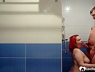 Girl with bright red hair gives a blowjob to guy in the shower and receives facial cumshot 10