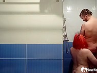 Girl with bright red hair gives a blowjob to guy in the shower and receives facial cumshot 6