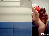 Girl with bright red hair gives a blowjob to guy in the shower and receives facial cumshot 8