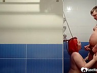 Girl with bright red hair gives a blowjob to guy in the shower and receives facial cumshot 9