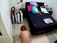 Hidden camera filming a young girl walking around naked and doing workout in her bedroom 9