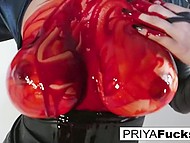 Eccentric Asian stunner Priya Rai seductively covers her body with artificial blood in front of the camera 9