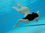 Young dark-haired babe Katy swims in the pool demonstrating her small tits and gorgeous ass 8