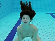 Young dark-haired babe Katy swims in the pool demonstrating her small tits and gorgeous ass 9