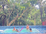 Long-haired amateur cuties blow their boyfriends by the pool and copulate with them in a foursome  11