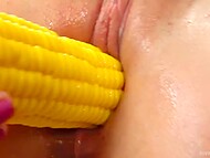 Good-looking slut provocatively penetrates own trimmed pussy with a corn-like dildo 4