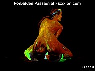 Attractive princess covered in amazing fluorescent paint relaxes solo using a dildo 8
