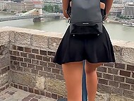 Girl with dark hair spends time with boyfriend in the fresh air and shows what is under the skirt 5