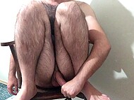 Hairy bear jerks his cut dick off in front of the camera and cums on the chair 7