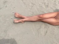 Slender babe poses on the deserted beach and gives blowjob to her cameraman 7