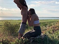 Slender babe gets on the knees to suck lover's dick and exposes her ass in the open air 6