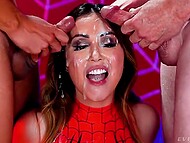 Awesome Asian Spiderwoman with huge breasts blows two huge dicks and gets dirty facial cumshots 11