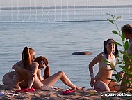 Four nude teen wenches play  beach volleyball and get down to having lesbian sex in the sand 6