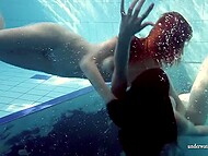 Redhead beauty takes off her sexy bikini and swims in the pool surrounded by young girlfriends 8