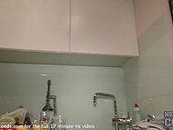 Nude Russian student poses for the camera when sticking long veggies into her moist cunt in the kitchen 11