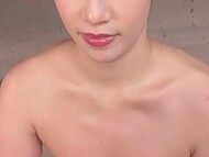 Submissive Asian woman pleases her man by giving him a foot massage and then inviting him to relax  11