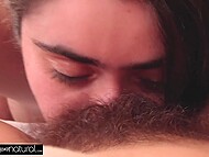 Very hairy young lesbians caress their natural tits and lick unshaved pussies on the sofa 8