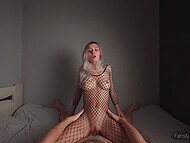 Busty blonde in a sexy fishnet suit rides big dick and waits for the sweetest orgasm in cowgirl pose 10