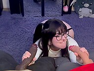 Slutty brunette with glasses blows a huge black and a massive white dildo and covers her face with fake cum in POV 11