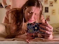 Young brown-haired bitch with a nose piercing films on her phone doggystyle fucking with lover