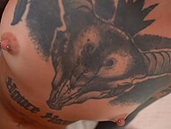 Dark-haired slut with numerous tattoos and piercings gets cum on her stomach after a passionate fuck 9