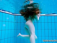 Shapely young woman displays stunning nude form beneath aquatic depths 10