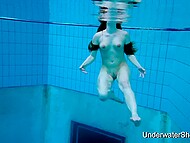Shapely young woman displays stunning nude form beneath aquatic depths 11