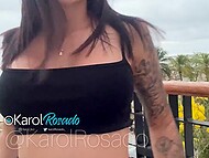 Sexy brunette Karol plays with her cute cunny and gives little squirts on the balcony at the beach hotel 4