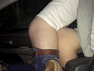 A man and his girlfriend squeeze between the seats for some carnal car action 4