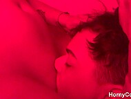 Teen couple indulges in steamy, love-filled coupling under fiery hues of red light 6