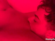 Teen couple indulges in steamy, love-filled coupling under fiery hues of red light 7