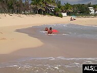 Sara Jaymes engages in steamy lesbian acts on a populated beach 11