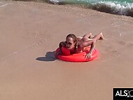 Sara Jaymes engages in steamy lesbian acts on a populated beach 4