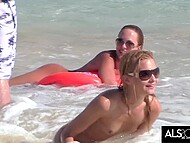 Sara Jaymes engages in steamy lesbian acts on a populated beach 5
