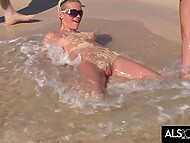 Sara Jaymes engages in steamy lesbian acts on a populated beach 9