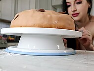 Buxom seductress Cubbi Thompson exposes her huge naturals when baking a giant cookie cake 11