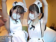 Japanese cosplay lasses in frilly aprons delight a lucky man with a double handjob 7