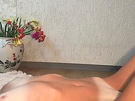 Skinny girl with tan lines takes off bra and panties to masturbate in front of the camera 11
