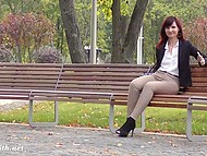Naughty Russian girl sits in the park and flashes her trimmed pussy through special hole in her pants 7