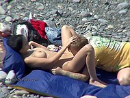 Girls make it on beach with men while voyeur captures babes getting it on all around 9