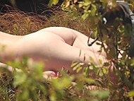Languid girl opens intimate body parts to sun's rays and voyeur's camera in the fresh air 4